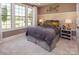 Cozy bedroom with large windows, neutral decor, and plush carpeting at 5059 Valita Rd, York, SC 29745