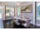 Elegant dining room features dark wood floors, designer lighting, and sophisticated decor at 5059 Valita Rd, York, SC 29745