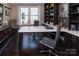 Stylish home office with built-in shelving, modern desk, and comfortable seating area at 5059 Valita Rd, York, SC 29745