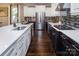 Modern kitchen featuring stainless steel appliances, dark wood floors, and white quartz countertops at 5059 Valita Rd, York, SC 29745
