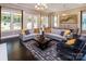 Bright living room features large windows, an open floor plan, and contemporary furnishings, adjacent to the dining area at 5059 Valita Rd, York, SC 29745