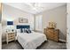 Cozy bedroom featuring soft carpeting, blue and white accents, and neutral wall colors at 5075 Valita Rd, York, SC 29745