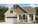 Charming two-story home featuring a combination of brick and siding and a two car garage at 5075 Valita Rd, York, SC 29745