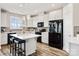 Spacious kitchen featuring an island with bar seating, white cabinets, and appliances at 5075 Valita Rd, York, SC 29745