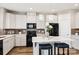 Contemporary kitchen with white cabinetry, stainless appliances, an island and seating at 5075 Valita Rd, York, SC 29745
