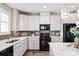 Bright kitchen with white cabinets, stainless steel appliances, and stylish backsplash at 5075 Valita Rd, York, SC 29745