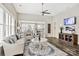 Bright living room with wood floors, stylish furniture, and an open view into the dining area at 5075 Valita Rd, York, SC 29745