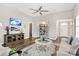 Bright living room with a ceiling fan, TV, and wooden floors, and an open layout at 5075 Valita Rd, York, SC 29745