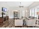 Comfortable living room with wood flooring, neutral colors, and a built-in decorative shelf at 5075 Valita Rd, York, SC 29745