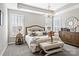 Inviting primary bedroom with a chandelier, large windows, and neutral decor at 5075 Valita Rd, York, SC 29745