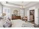 A serene primary bedroom featuring a chandelier, large dresser and an en-suite bathroom at 5075 Valita Rd, York, SC 29745