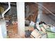 Unfinished basement showing cinder block walls, brick wall and stored goods at 5127 Murrayhill Rd, Charlotte, NC 28210