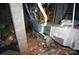 Basement showing air ducts, a cinder block column and clutter at 5127 Murrayhill Rd, Charlotte, NC 28210