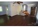 Living room with hardwood flooring, a ceiling fan, and natural light creates a bright, airy atmosphere at 5127 Murrayhill Rd, Charlotte, NC 28210