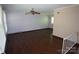 Spacious living area boasts hardwood floors, neutral walls, and a ceiling fan, offering comfort and style at 5127 Murrayhill Rd, Charlotte, NC 28210