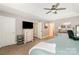 Cozy bedroom featuring a ceiling fan, soft lighting, and neutral tones for a relaxing atmosphere at 516 Tribune Dr, Charlotte, NC 28214