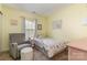 Charming bedroom with cozy chair, rug, pink accents, and twin bed at 516 Tribune Dr, Charlotte, NC 28214