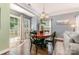 Cozy dining area adjacent to the living room, featuring hardwood floors and sliding glass doors at 516 Tribune Dr, Charlotte, NC 28214