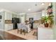 Charming kitchen with white cabinets, tiled backsplash, stainless steel appliances, and functional island at 516 Tribune Dr, Charlotte, NC 28214