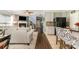 Open-concept living room showcases hardwood floors, natural light, and seamless flow to kitchen and dining areas at 516 Tribune Dr, Charlotte, NC 28214