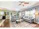 Cozy living room with hardwood floors, neutral paint, ample natural light, and comfortable seating at 516 Tribune Dr, Charlotte, NC 28214