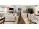 Open-concept living room showcases hardwood floors, natural light, and seamless flow to kitchen and dining areas at 516 Tribune Dr, Charlotte, NC 28214