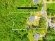 Aerial view of lot lines showing 1.72 acres surrounded by dense greenery at 5615 American Way, Denver, NC 28037