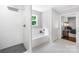 Bright bathroom featuring a tub, separate shower and tile floors at 5615 American Way, Denver, NC 28037