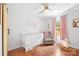 Charming Bedroom with hardwood floors, crib, chair and plenty of natural light at 5615 American Way, Denver, NC 28037