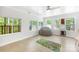 Bright bonus room with a large beanbag, a fun rug and lots of windows to enjoy the view at 5615 American Way, Denver, NC 28037