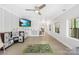 Spacious bonus room featuring tile floors, a ceiling fan, and plenty of natural light at 5615 American Way, Denver, NC 28037