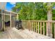 View of the beautiful deck that includes a grill and view of nature and trees at 5615 American Way, Denver, NC 28037