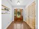 Elegant entryway with wood floors, stylish lighting, and wooden accent doors at 5615 American Way, Denver, NC 28037