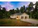 Charming home with a well-manicured lawn, two-car garage, and inviting front entrance at 5615 American Way, Denver, NC 28037