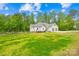 Beautiful home with a manicured lawn, quaint fence, and two-car garage at 5615 American Way, Denver, NC 28037