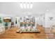 The kitchen features a large island bar and overlooks the dining and living areas at 5615 American Way, Denver, NC 28037