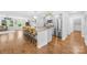 Bright kitchen features a large island with seating and stainless steel appliances at 5615 American Way, Denver, NC 28037