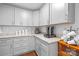 Convenient kitchenette area with gray cabinets, granite counters and beverage station at 5615 American Way, Denver, NC 28037