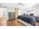 Bright main bedroom features barn door, ceiling fan and decorative headboard at 5615 American Way, Denver, NC 28037