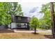 Backyard featuring a patio, landscaping, and partial view of surrounding trees at 6501 Piney Path Rd, Charlotte, NC 28212