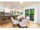 Open concept dining area adjacent to modern kitchen with stainless steel appliances at 6501 Piney Path Rd, Charlotte, NC 28212