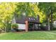 Charming home with a well-manicured lawn, inviting front porch, and mature trees providing shade and curb appeal at 6501 Piney Path Rd, Charlotte, NC 28212