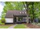 Charming home featuring a modern pergola, skylights, and mature landscaping at 6501 Piney Path Rd, Charlotte, NC 28212
