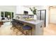 Modern kitchen featuring a breakfast bar with seating, stainless steel appliances at 6501 Piney Path Rd, Charlotte, NC 28212