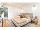 Cozy primary bedroom with neutral tones, accent wall, and ensuite bathroom at 6501 Piney Path Rd, Charlotte, NC 28212