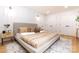 Inviting main bedroom with a plush bed, decorative wall paneling, and ample closet space for a relaxing retreat at 6501 Piney Path Rd, Charlotte, NC 28212