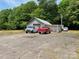View of driveway with garage and multiple cars at 6504 Denver Heights Cir, Denver, NC 28037