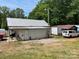 Exterior of the property shows outbuildings, shed, van, and spacious yard at 6504 Denver Heights Cir, Denver, NC 28037