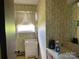 Bathroom with floral wallpaper and vanity at 675 E Ritchie Rd, Salisbury, NC 28146