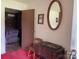 The entryway features a mirrored wall and a view to another room at 675 E Ritchie Rd, Salisbury, NC 28146
